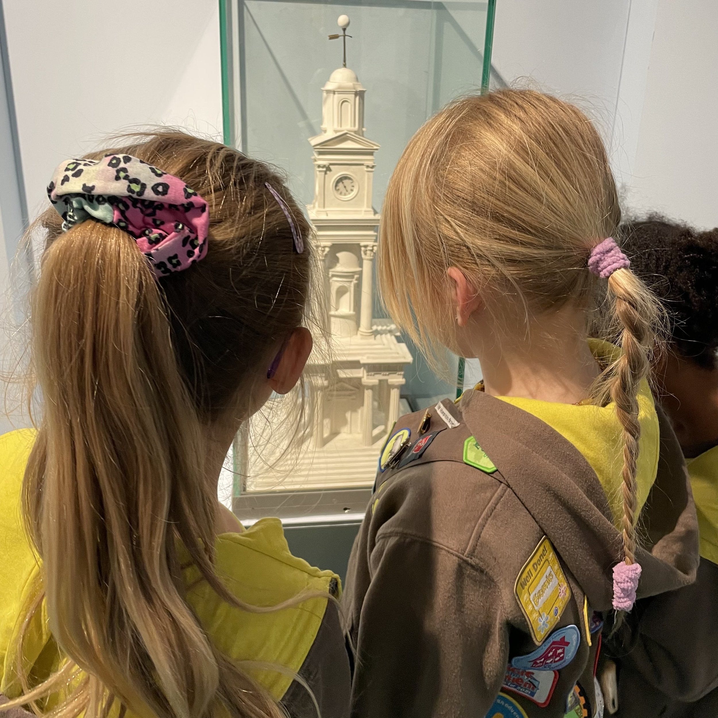 Brownies looking at a model of the Herne Bay clocktower.